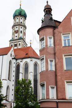 Travel to Germany - St Ulrich and St Afra Church and urban house in Augsburg city in cloudy spring day