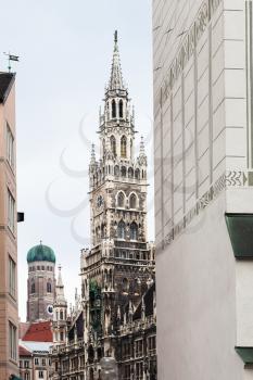Travel to Germany - view of towers of New City Hall (Neues Rathaus) and Frauenkirche Cathedral from Old Town Hall (Alte Rathaus) on Marienplatz in Munich city