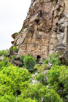 Travel to Turkey - slope with ancient rock-cut caves in Ihlara Valley of Aksaray Province in Cappadocia in spring