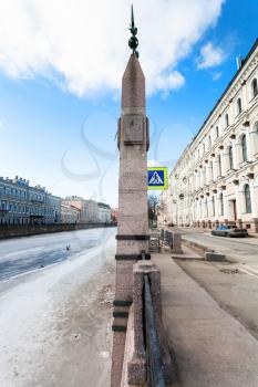 street sign with High water mark of flood level on Moyka river embankment in Saint Petersburg city in spring