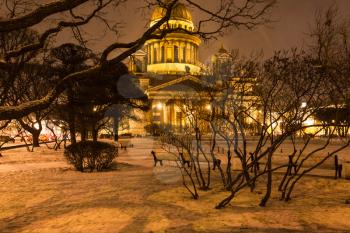 snowy garden near Saint Isaac's Cathedral on St Isaac Square in Saint Petersburg city in night snowfall