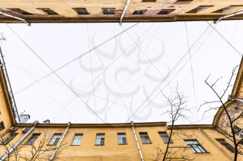 bottom view of many electrical wires and cables over urban patio in Saint Petersburg city in Saint Petersburg city in spring morning
