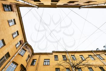 bottom view of many electrical wires and cables over urban courtyard in Saint Petersburg city in Saint Petersburg city in spring morning
