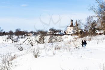 cityscape of Suzdal town with Holy Cross Exaltation and St Cosmas and St Damian Churches in Korovniki district in winter in Vladimir oblast of Russia