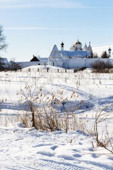 Convent of the Intercession (Pokrovskiy Monastery) on riverbank of frozen river in Suzdal town in winter in Vladimir oblast of Russia