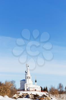 view of Church of Saints Cosmas and Damian (Kozmodemyanskaya Church) on Yarunova Hill from ravine in Suzdal town in winter in Vladimir oblast of Russia