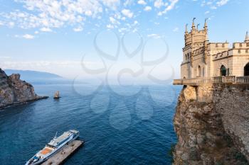 travel to Crimea - above view of pier and Swallow Nest castle over Black Sea on Crimean Southern Coast in evening