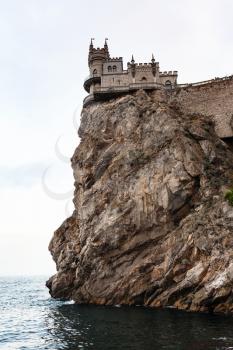 travel to Crimea - Swallow's Nest Castle on Aurora Cliff of Ay Todor cape over Black Sea in evening