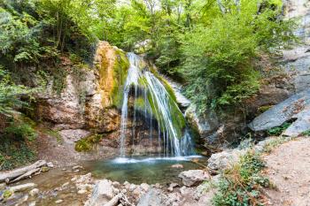 travel to Crimea - Ulu-Uzen river with Djur-djur waterfall in Haphal Gorge of Habhal Hydrological Reserve natural park in Crimean Mountains in autumn. It is the most full-flowing waterfall in Crimea