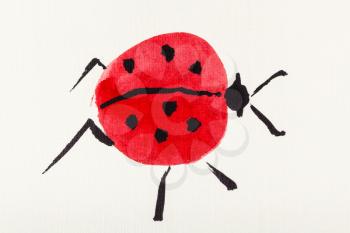 hand painting in sumi-e style on cream paper - one ladybug drawn by watercolors