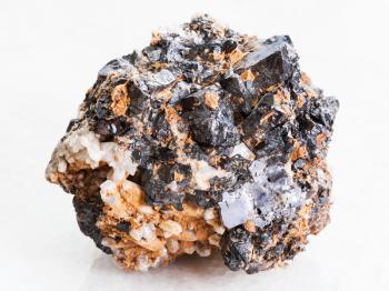 macro shooting of natural mineral rock specimen - Sphalerite with Galena ore on white marble background from Far East region of Russia