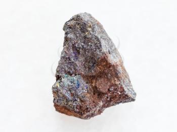 macro shooting of natural mineral rock specimen - magnetite (iron ore) stone on white marble background