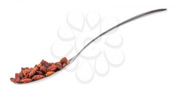 side view of spoon with dried goji berries isolated on white background