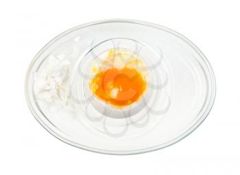 top view of open boiled white egg in glass egg cup isolated on white background