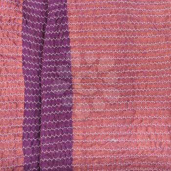 workshop on sewing a patchwork scarf - pink textile background from stitched strips of silk fabrics