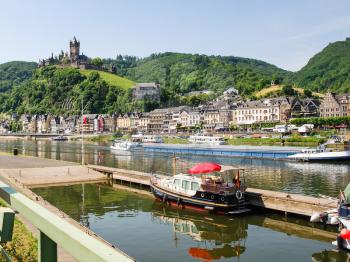 travel to Germany - view of waterfront of Cochem city and Reichsburg Cochem castle in summer day