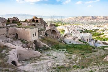 Travel to Turkey - rock-cut houses in Uchisar village in Cappadocia in spring