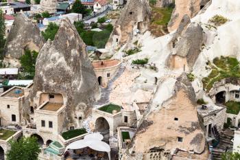Travel to Turkey - urban houses in rock-cut caves in Goreme town in Cappadocia in spring