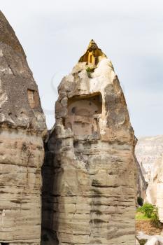 Travel to Turkey - cave house in fairy chimney rock in Goreme National Park in Cappadocia in spring