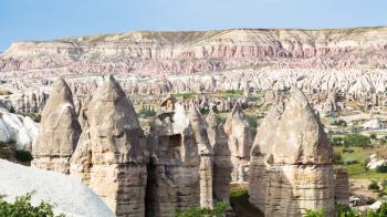 Travel to Turkey - old fairy chimney rocks in mountain valley of Goreme National Park in Cappadocia in spring