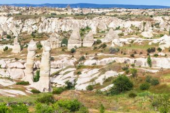 Travel to Turkey - mountain scenic with fairy chimney rocks inGoreme National Park in Cappadocia in sunny spring day