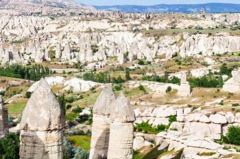 Travel to Turkey - above view of fairy chimney rocks in mountain valley of Goreme National Park in Cappadocia in spring