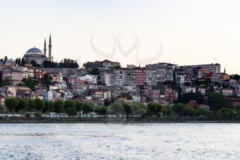 Travel to Turkey - quayside in Fatih district in Istanbul city in spring evening from Golden Horn bay