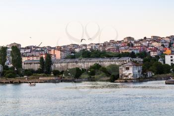 Travel to Turkey - view of seaside in Istanbul city in spring evening from Golden Horn bay