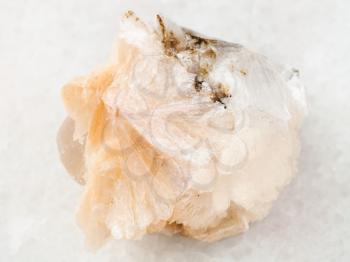 macro shooting of natural mineral rock specimen - Thomsonite stone on white marble background