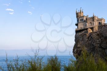 travel to Crimea - view of Swallow Nest Castle on Aurora Cliff in Haspra District on Crimean South Coast of Black Sea in evening