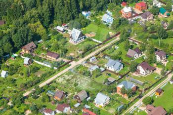 above view of cottages in suburb village in Moscow Region in Istrinsky district in summer day