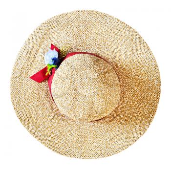 top view of wide brim straw hat with red band and textile flower isolated on white background