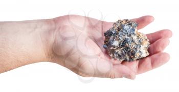 side view of zinc and lead mineral ore (sphalerite with galena) on male palm isolated on white background