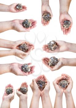 set of various hands with natural zinc and lead mineral ore (sphalerite with galena) isolated on white background