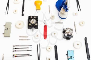 watchmaker workshop - collage of various tools for watch repairing on white background
