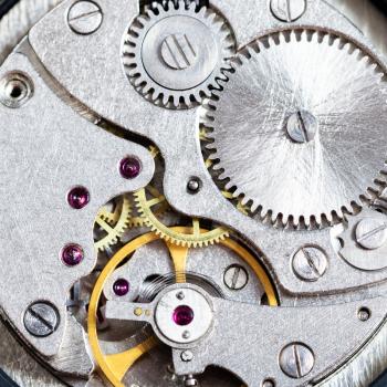watchmaker workshop - gears of mechanical clockwork close up