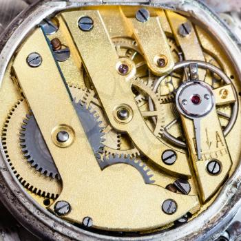 watchmaker workshop - brass clockwork of old mechanical pocket watch