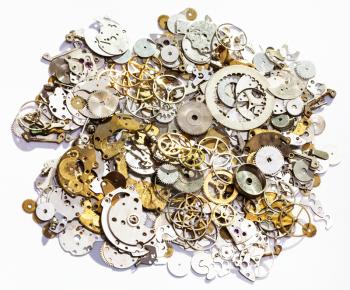 watchmaker workshop - heap of old watch spare parts on white background