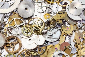 watchmaker workshop - many used watch spare parts close up
