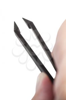 above view of male fingers holding black plastic anti-static tweezers with sharp tips isolated on white background