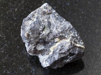 macro shooting of natural mineral rock specimen - Sphalerite ore on dark granite background from Mount Elbrus region, Caucasus, Russia