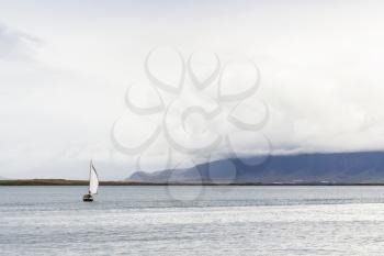 travel to Iceland - view of sailing ship in Atlantic ocean from promenade Sculpture and Shore Walk in Reykjavik city in september
