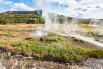 travel to Iceland - hot spring in Haukadalur geyser area in autumn
