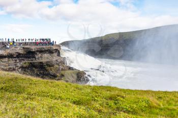 travel to Iceland - tourists on observation deck near Gullfoss waterfall in september