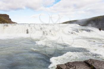 travel to Iceland - rapids of Gullfoss waterfall in canyon of Olfusa river in september