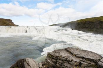 travel to Iceland - water flow on rapids of Gullfoss waterfall in canyon of Olfusa river in september