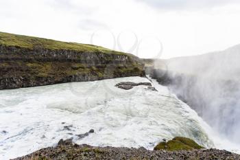 travel to Iceland - Gullfoss waterfall and water spray over canyon of Olfusa river in september