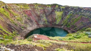 travel to Iceland - Kerid lake in volcanic crater in september evening