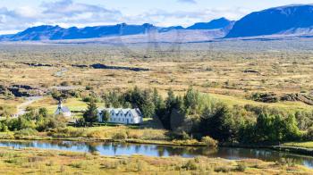 travel to Iceland - panorama of valley with Thingvallakirkja church in Thingvellir national park in autumn