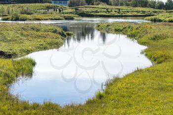 travel to Iceland - ponds in valley of Oxara river in Thingvellir national park in september